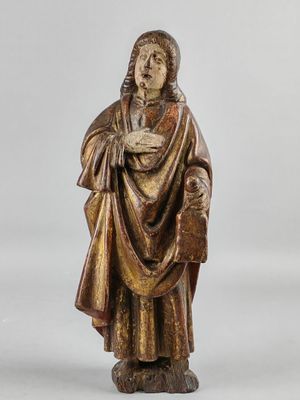 a statue of a man in a robe holding a book