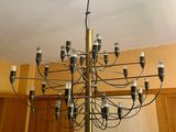 a chandelier that is hanging from the ceiling in a kitchen