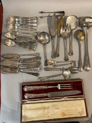 a lot of silverware on display on a table