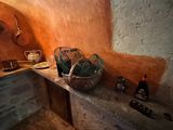 a kitchen with a sink and a counter with a basket on it