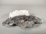 a piece of rock with a white substance on top of it