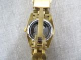 an image of a close up of a watch on a table