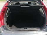 the back of a car with its trunk open and the back of the car with its trunk open