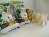 many bags of food sitting on a counter next to some bottles of liquid