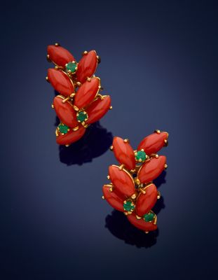 a pair of coral and emerald earrings