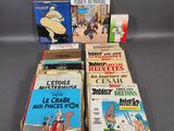 a group of books sitting on top of a table next to each other