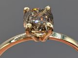 a close up of a diamond ring with a diamond in the center