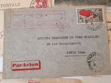 a pile of old postcards and envelopes on a table