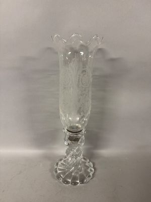 a clear glass vase sitting on top of a table