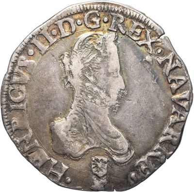 une pièce en argent portant le portrait d'un homme