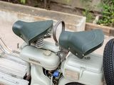 a scooter that is parked on the side of the road