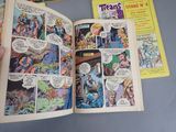 a person holding a comic book open on a table