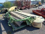 an image of a tractor and other farm equipment in a lot