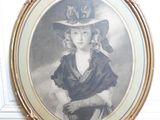 an old picture of a woman wearing a hat and a dress