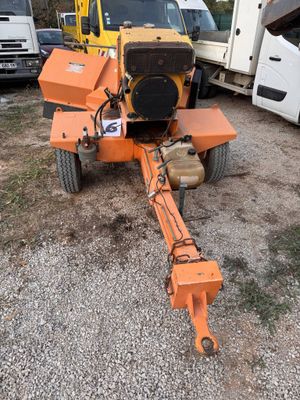 a small machine that is sitting in the dirt