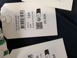 two tags on the back of a luggage bag