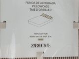 the label on the pillow case is attached to the pillow