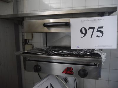 a picture of a stove in a kitchen with a price sign