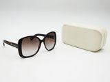 sunglasses and a case on a white surface with a white background