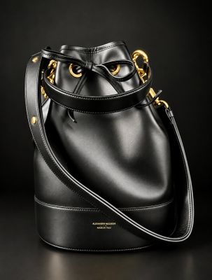 a black bucket bag on a black background
