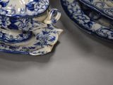 a blue and white plate and a blue and white bowl and saucer