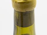 a bottle of beer with a yellow cap on it