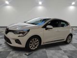 a white car parked in a garage with a checkered floor