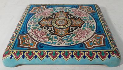 a blue table with a decorative design on it