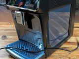 a coffee machine that is sitting on a wooden table