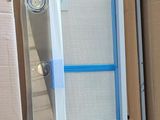 a cardboard box with a window in it that is open