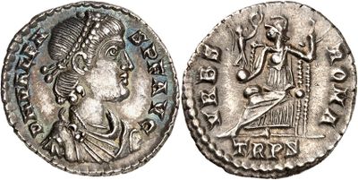 a silver coin with an image of a man on it