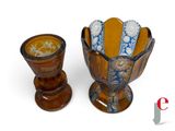 two vases that are sitting next to each other