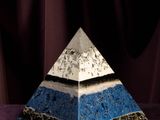 an image of a pyramid made of blue and white marbles