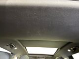 the interior of a car with the sunroof down and the sunroof down