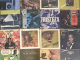 a lot of records on the wall of a room