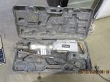 a tool in a case that is sitting on the floor