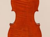 an old violin with a wooden back and bow on a white background
