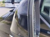 a car that has a mirror on the side of it