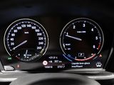 a close up of a car dashboard with a speedometer and gauges