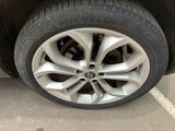 a close up of a tire on a car ' s rim