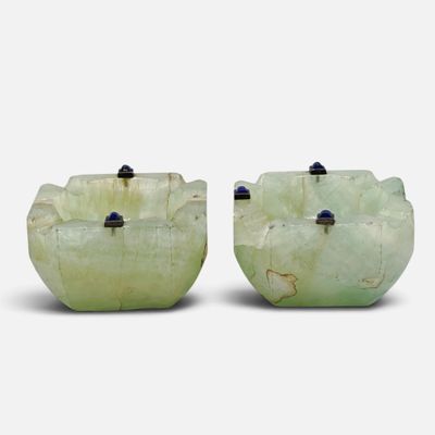 two pieces of green jade with black stones on each side