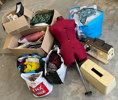 a pile of boxes and other items on the floor
