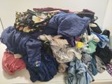 a pile of clothes that is on a counter