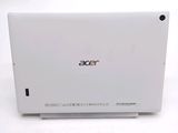 a close up of a laptop on a white surface