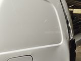a white van that is parked in a garage