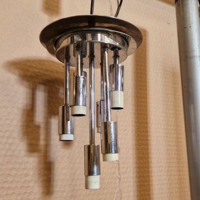 a metal and glass chandelier hanging from the ceiling