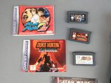 several video games and a game case on a table
