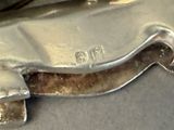 a close up of a piece of metal on a table