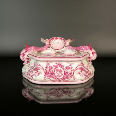 a pink and white box with a bird on it