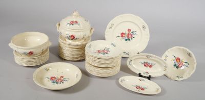 many plates and bowls that are sitting on a table